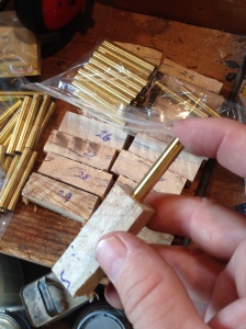 The pen blanks are drilled and a metal insert is glued into each piece.  It takes two pieces for each pen.  Every effort is made to keep the two pieces from the same piece of wood in order to have the top and bottom of the pen match.  